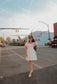 Scalloped white mini dress