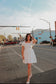 Scalloped white mini dress